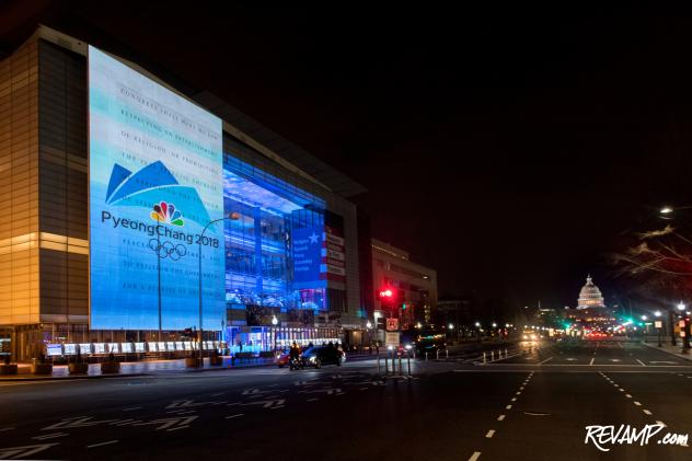 The logo of the PyeongChang Olympics was projected on the outside of the Newseum for the celebration.